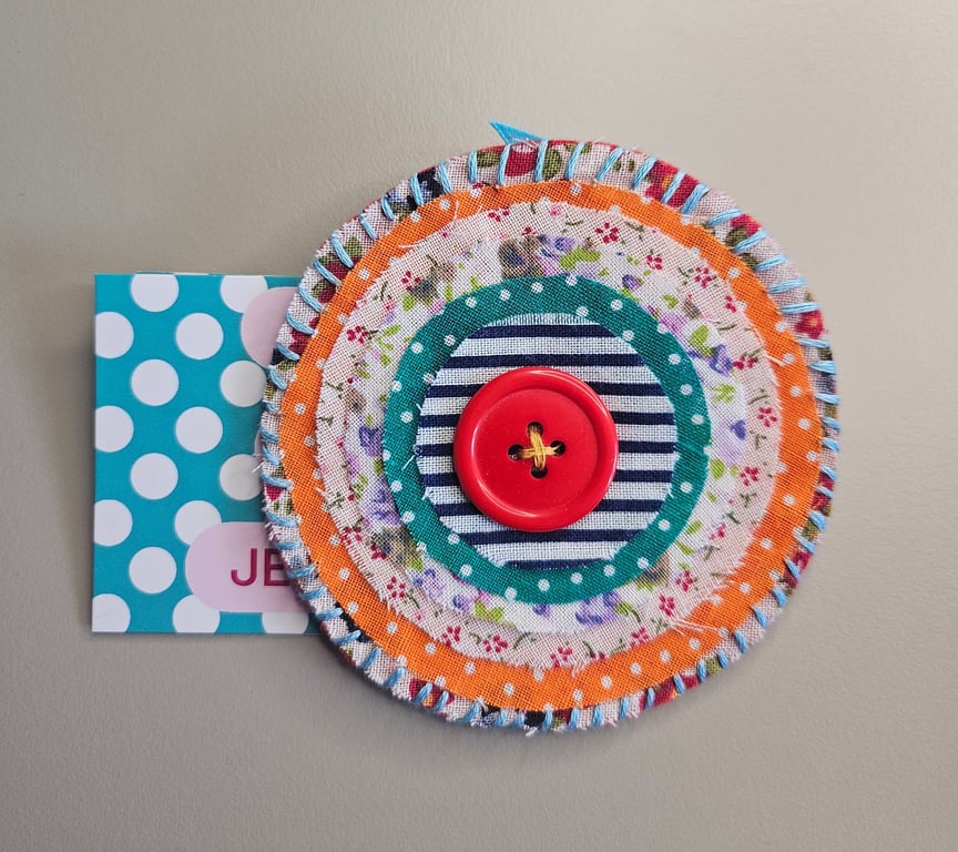 Orange rustic material brooch 