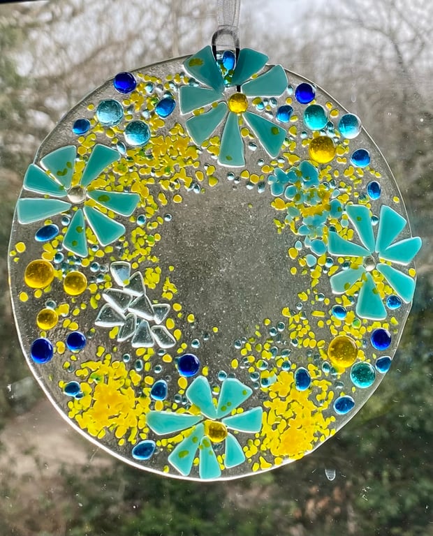 Fused glass hanging decoration in blues and yellows