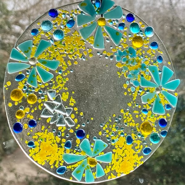 Fused glass hanging decoration in blues and yellows