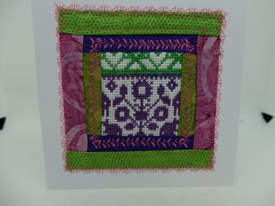 Log cabin quilt block with fragment of cross stitch centre, embroidered