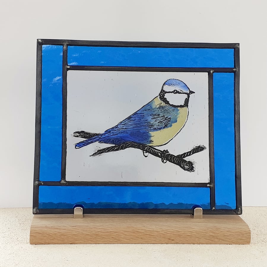 Leaded stained glass panel with painted blue tit design