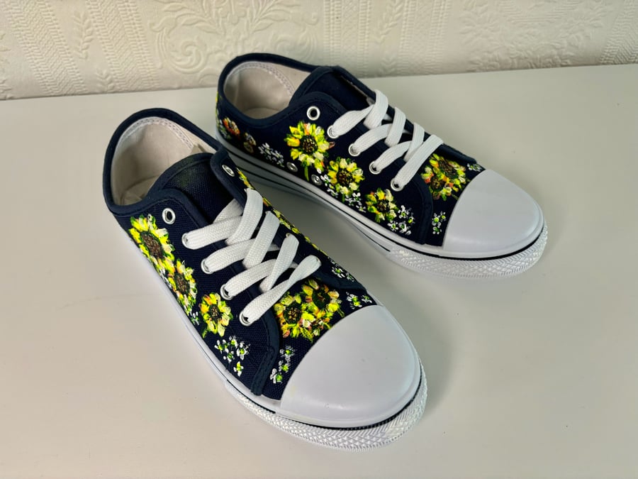 A pair of hand painted and sealed shoes by Andrew Jenkins 