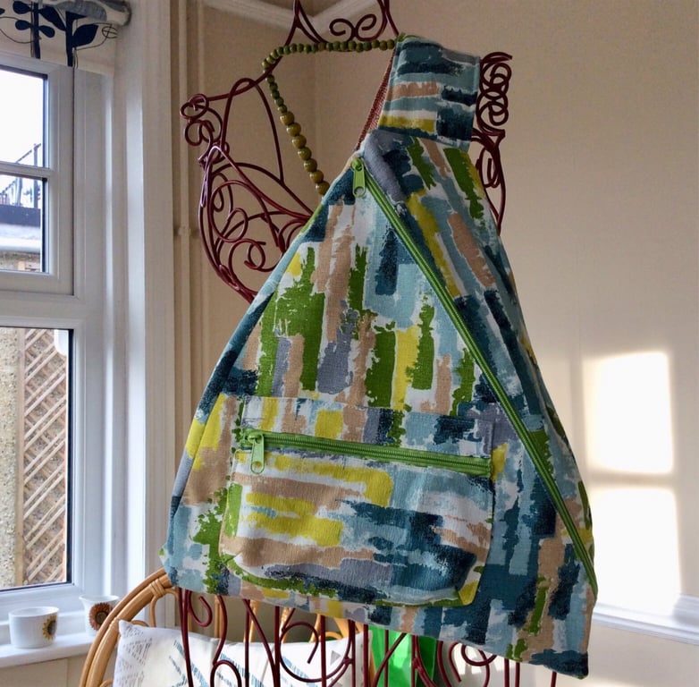 Ergonomic asymmetrical backpack in mid century barkcloth