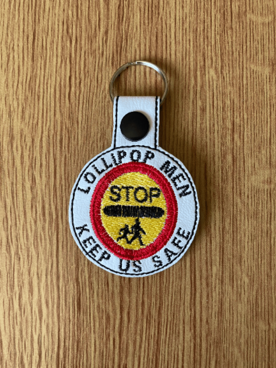 1185. Lollipop men keep us safe keyring.