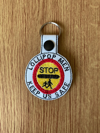 1185. Lollipop men keep us safe keyring.