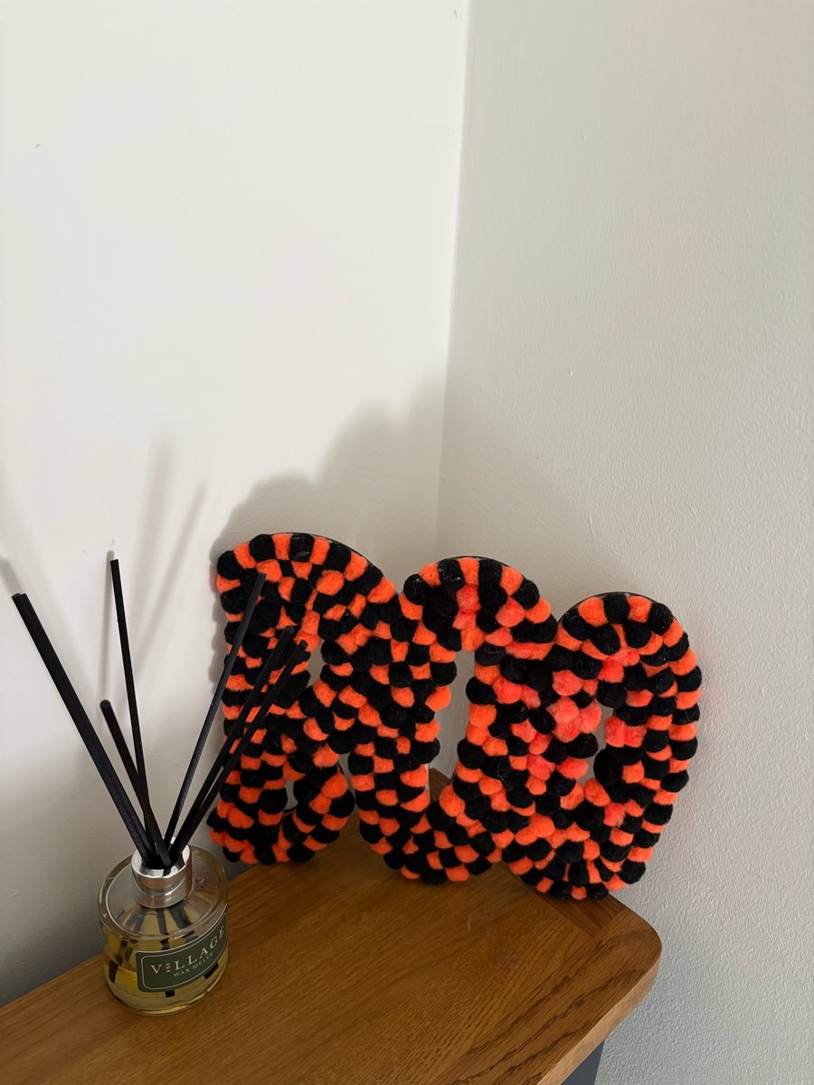 BOO Pom Pom decorated sign. 