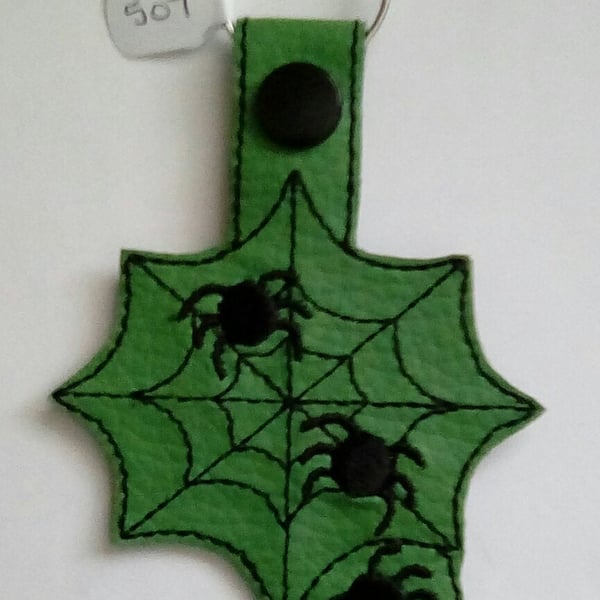 507. Spiders web keyring.