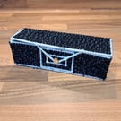 Pencil case with lid and gold button closure - black and grey with white edging