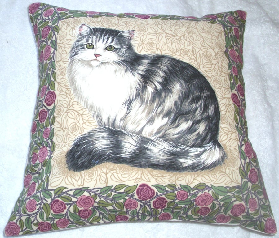 A very pretty fluffy grey tabby and white cat cushion