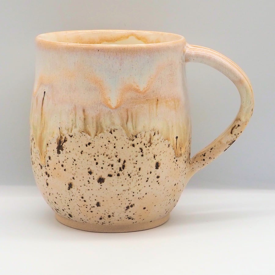 Large stoneware pottery mug finished in multi-colour brown cream glaze.