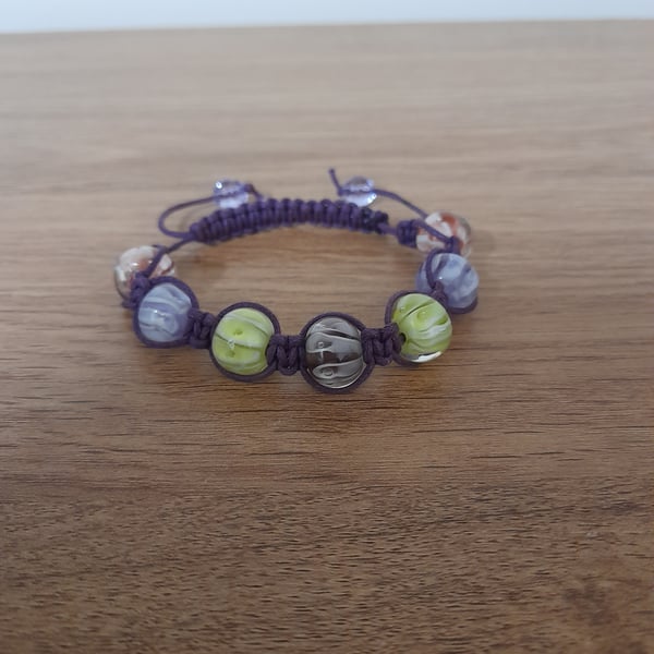SHADES OF PURPLE, PINK AND LIME MACRAME BEADED BRACELET.