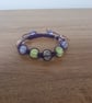 SHADES OF PURPLE, PINK AND LIME MACRAME BEADED BRACELET. - Image 1