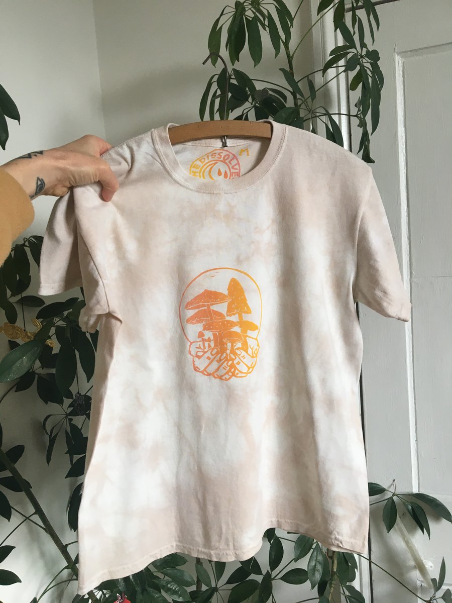Tie dyed, plant dyed peachy organic cotton t-shirt with mushroom linocut print.