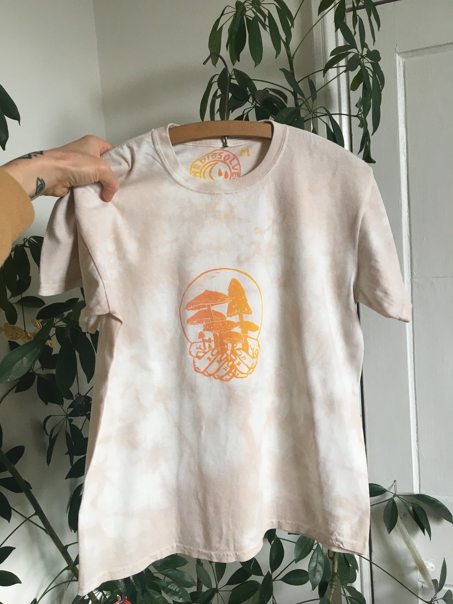 Tie dyed, plant dyed peachy organic cotton t-shirt with mushroom linocut print.