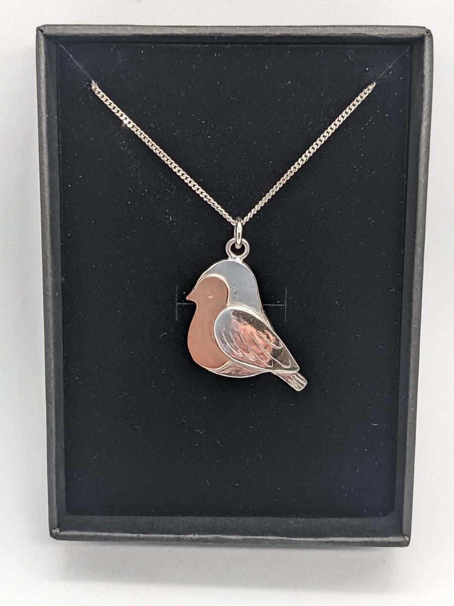 Handcrafted silver and copper robin pendant