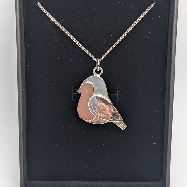 Handcrafted silver and copper robin pendant