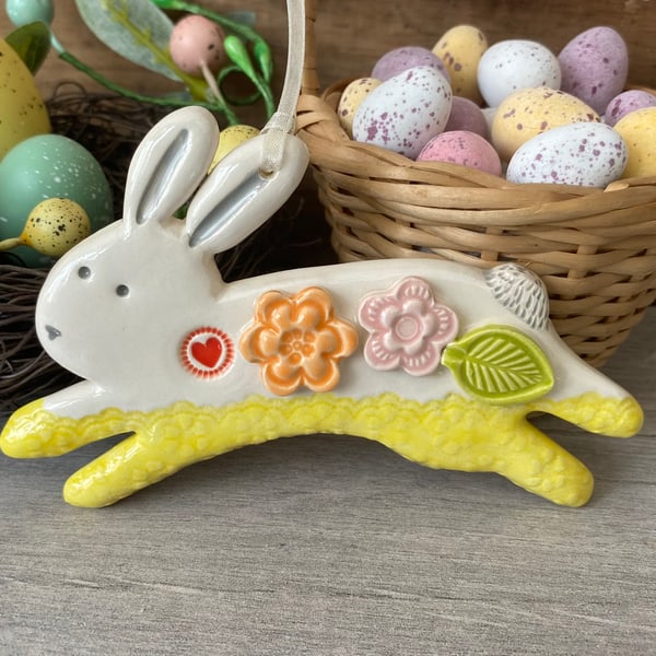 Ceramic Leaping Bunny decoration with flowers yellow