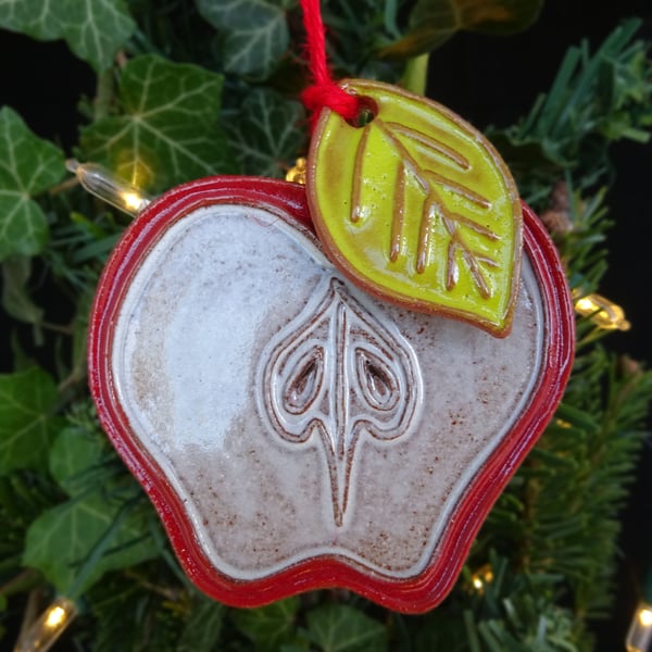 Apple slice with leaf pottery decoration