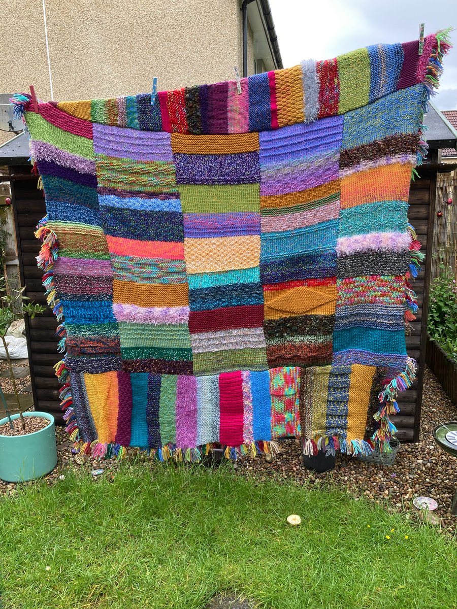 Multicoloured chunky hand knitted blanket
