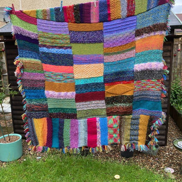 Multicoloured chunky hand knitted blanket