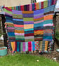 Multicoloured chunky hand knitted blanket