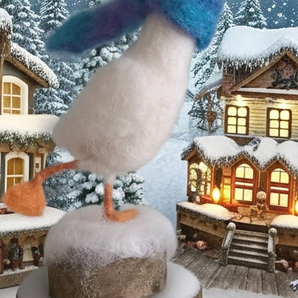 Needle felted skating goose in snow wearing scarf