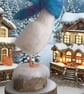 Needle felted skating goose in snow wearing scarf