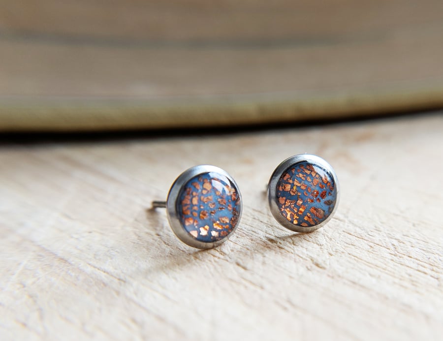 Dusty blue and rose gold ear studs in 316L steel settings