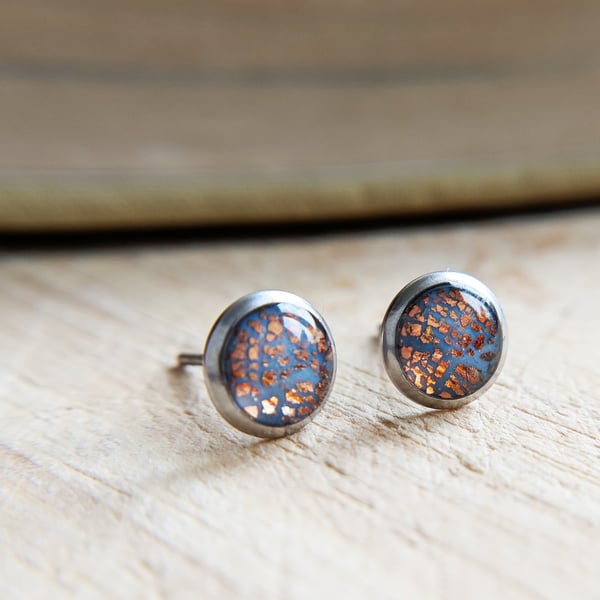 Dusty blue and rose gold ear studs in 316L steel settings