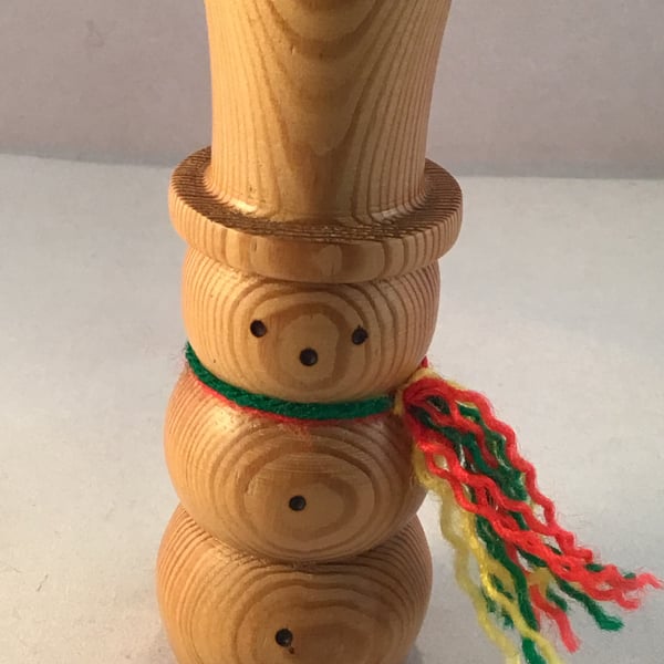 Natural wood snowman.