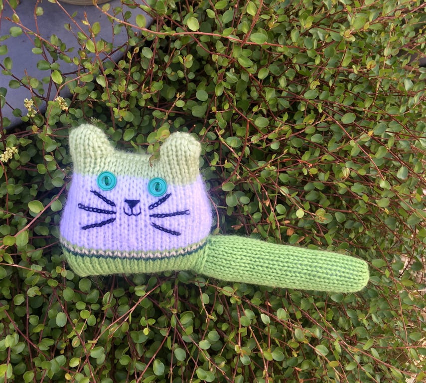 Green hand knitted kitten decoration 