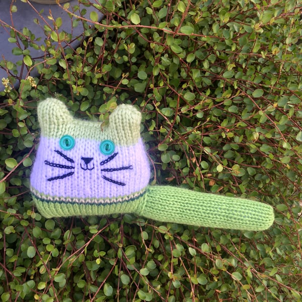 Green hand knitted kitten decoration 