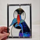 Stained glass puffin sea bird panel.