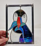 Stained glass puffin sea bird panel.