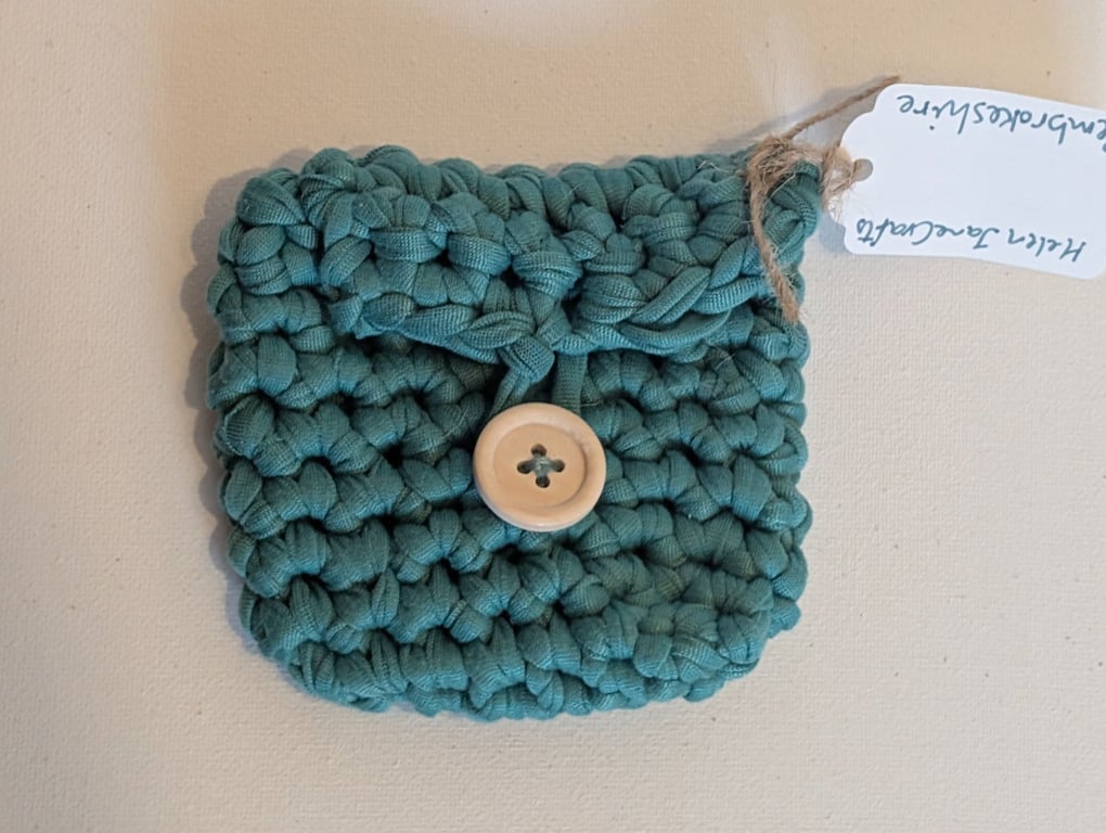 Handmade crochet mini purse made with green t-shirt yarn 