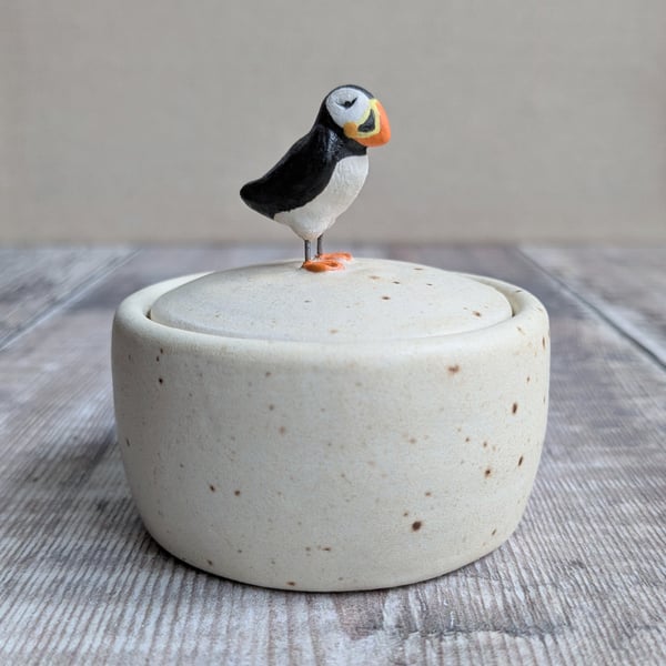 Small handmade ceramic lidded pot with puffin