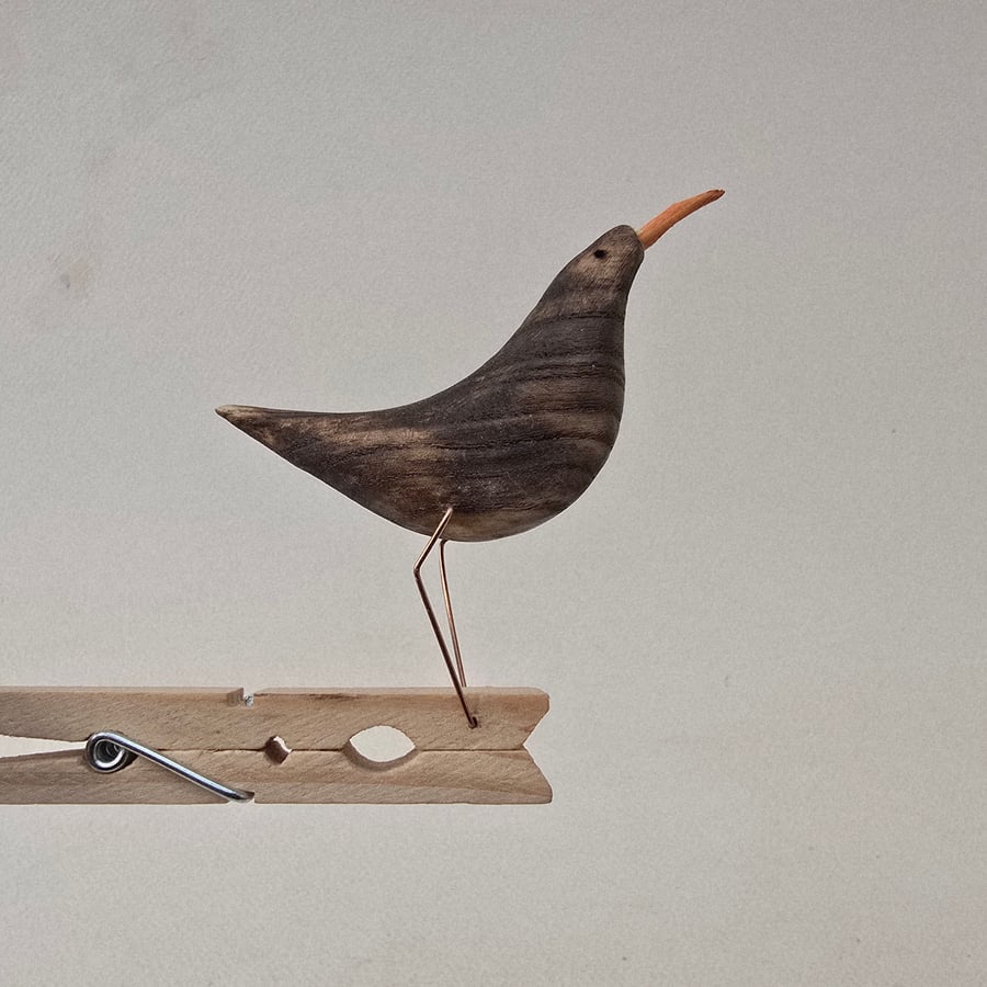 Pecking peg bird