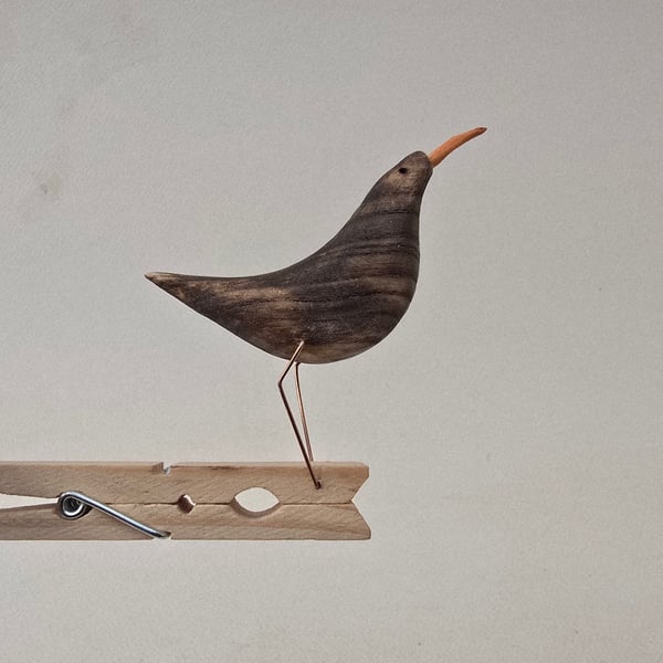 Pecking peg bird