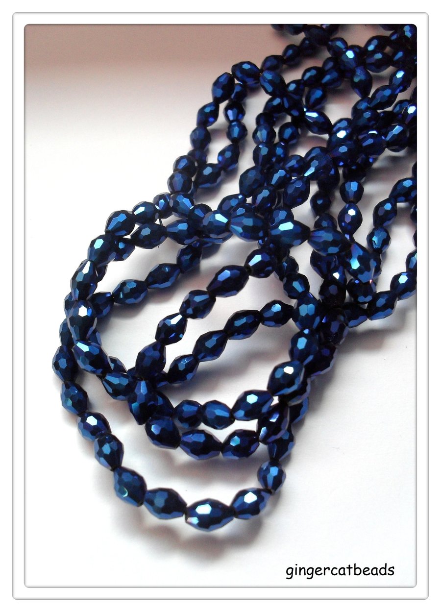 100 x Glass Beads - Faceted Rice - 6mm x 4mm - Blue Electroplated 