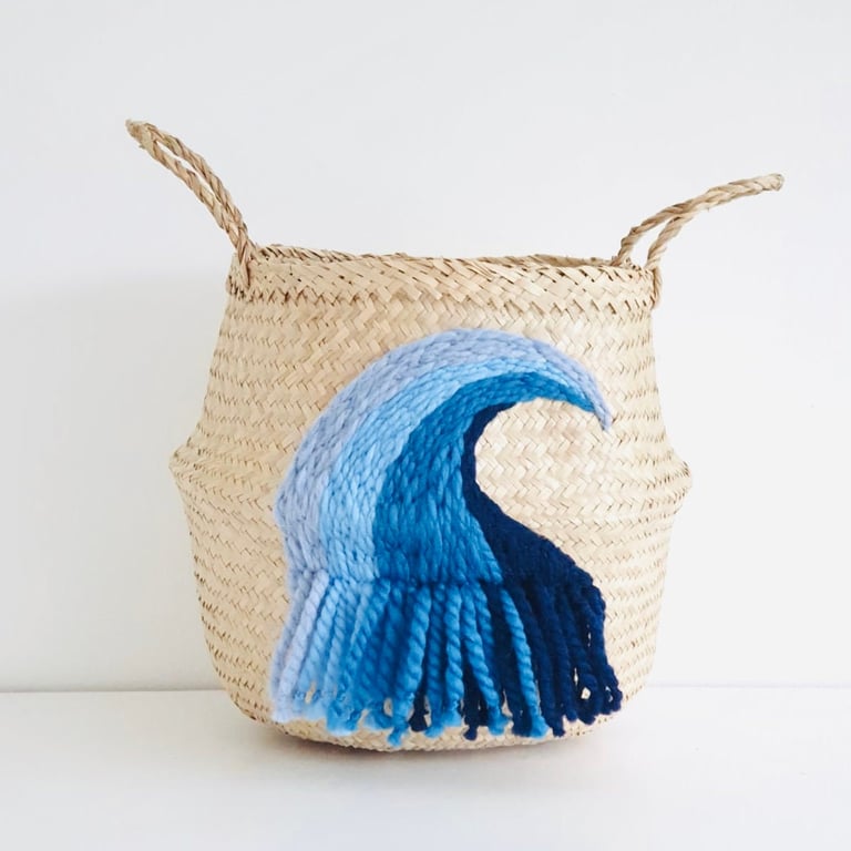 Wave hand embroidered seagrass belly basket in blue for kids toy storage