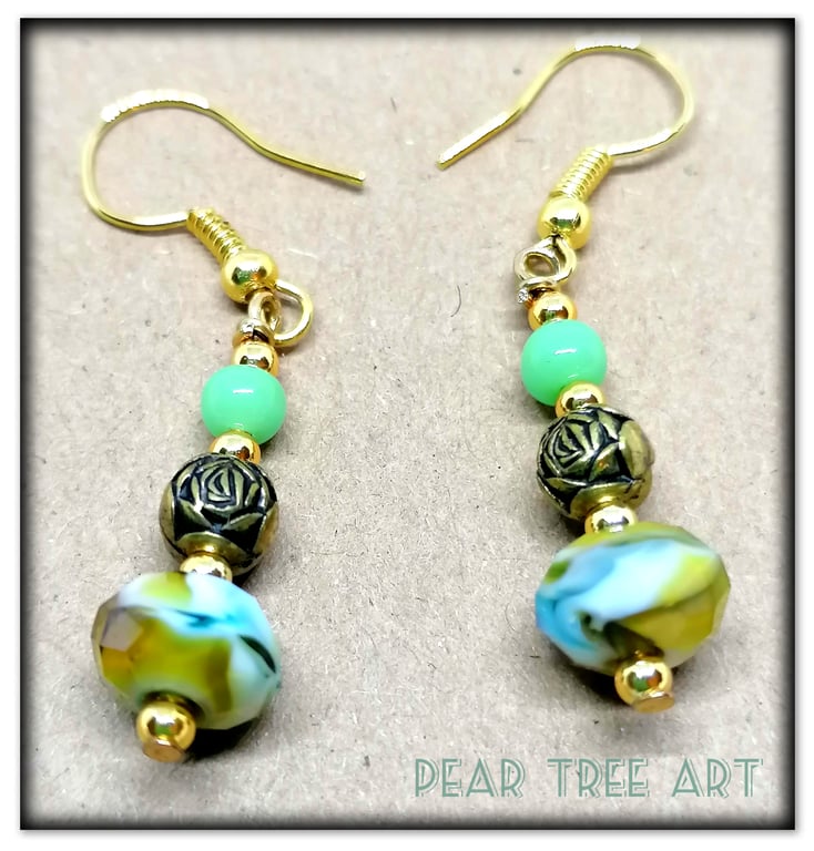 Small green crystal glass bead earrings on gold plated hooks.