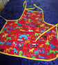 Baby Apron with Colourful Cats & Dogs - Image 1
