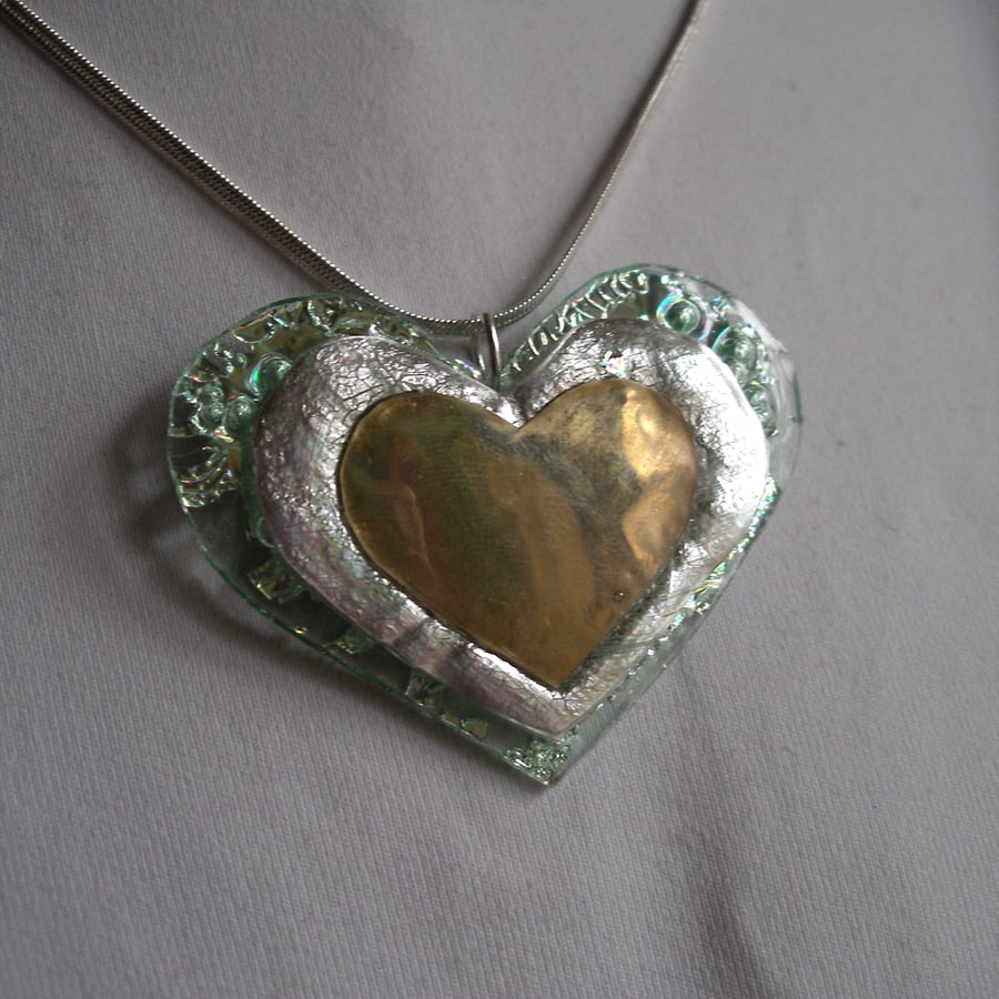 Colourful reflective heart pendant.