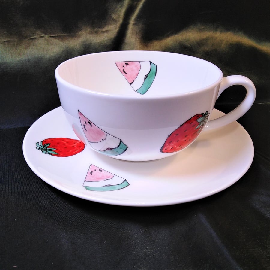 Tea cup and saucer decorated with strawberries and watermelon in fine bone china
