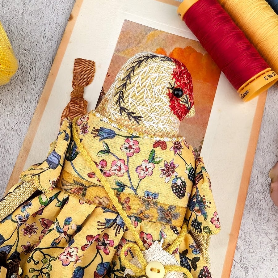 Sappho,  A Tiny Hand Embroidered Goldfinch Folk Art Doll