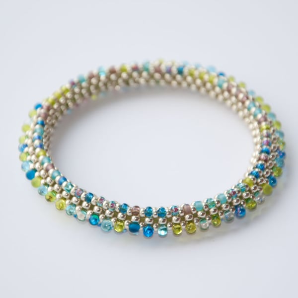 Silver with turquoise, lime and lilac beadwoven bangle
