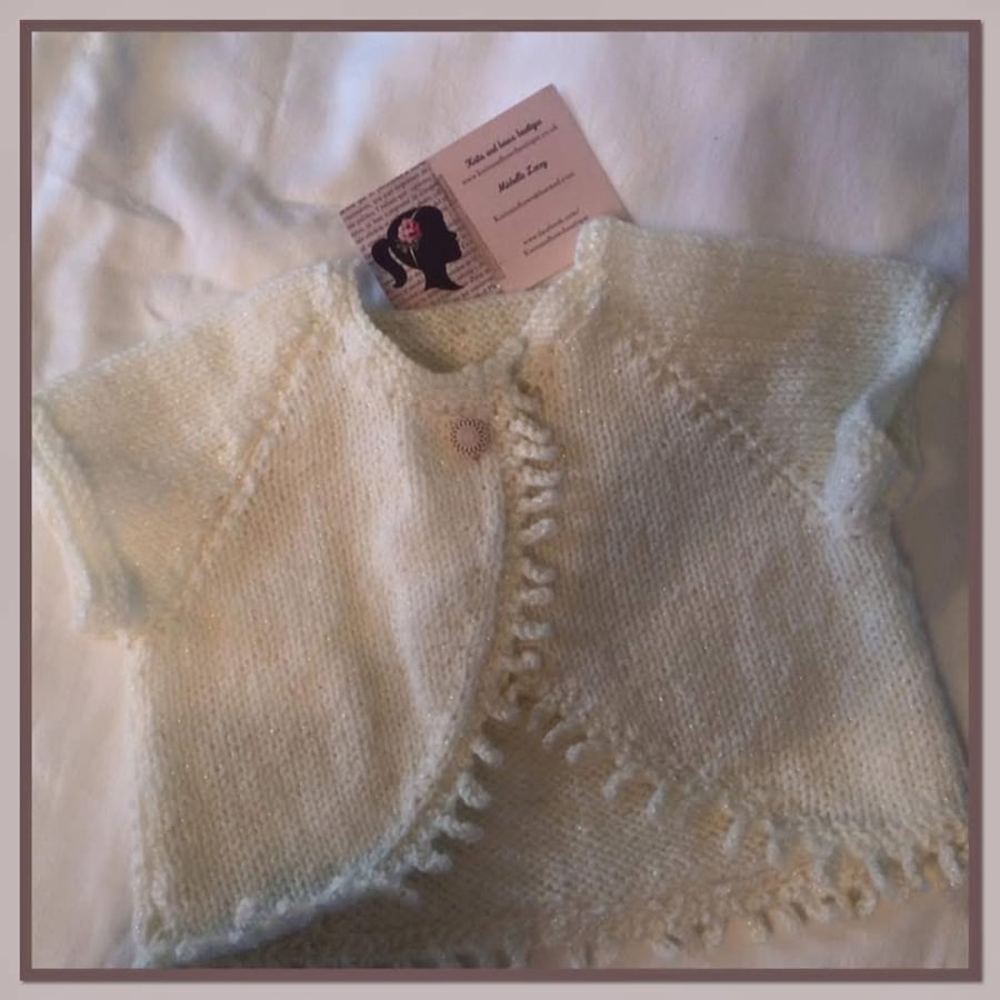 Hand-Knitted Ivory Sparkle Baby Bolero with Ruffle Trim – Newborn to 6 Months