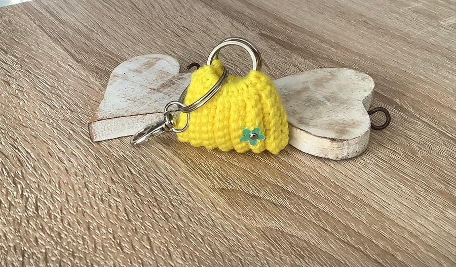 Small bag, key, earbuds, spare change holder.