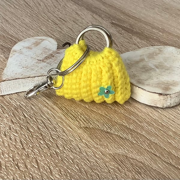 Small bag, key, earbuds, spare change holder.