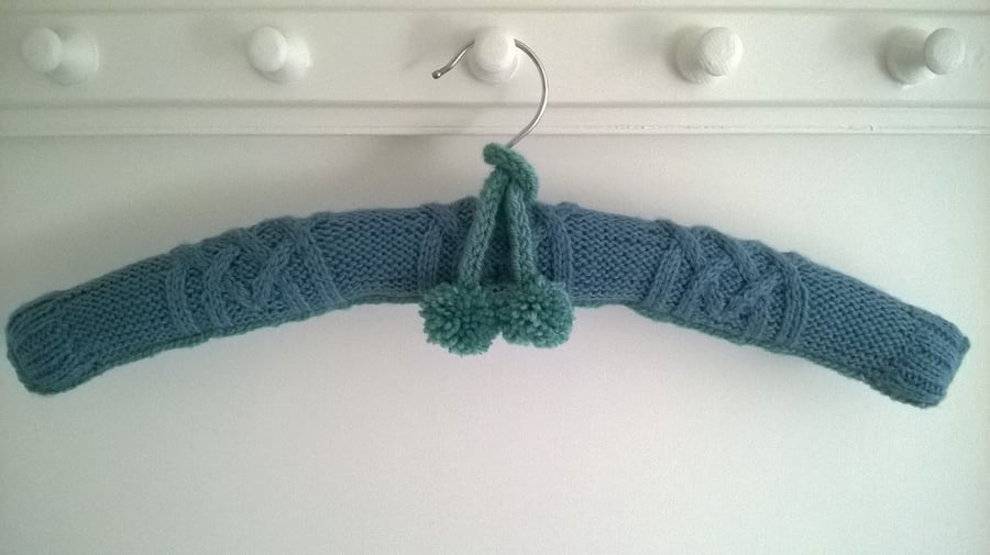 Hand knitted cable and scarf ladies coat hanger